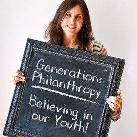 Robyn Hochglaube holding a sign