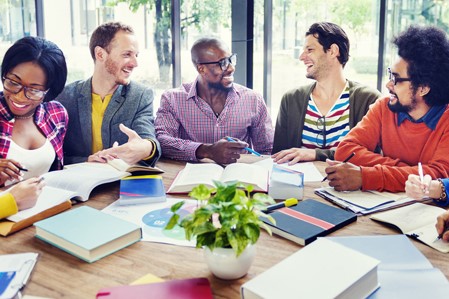 Students discussing around a table