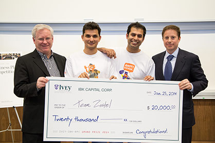 Team Zostel holding winning cheque from MBS Ivey Business Plan Competition 2014