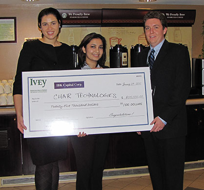 Team CHAR Technologies holding winning cheque from MBA Ivey Business Plan Competition 2011